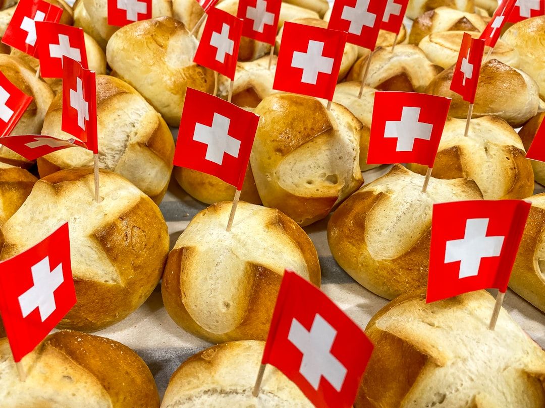 Traditional Swiss bread rolls decorated with small Swiss flags.